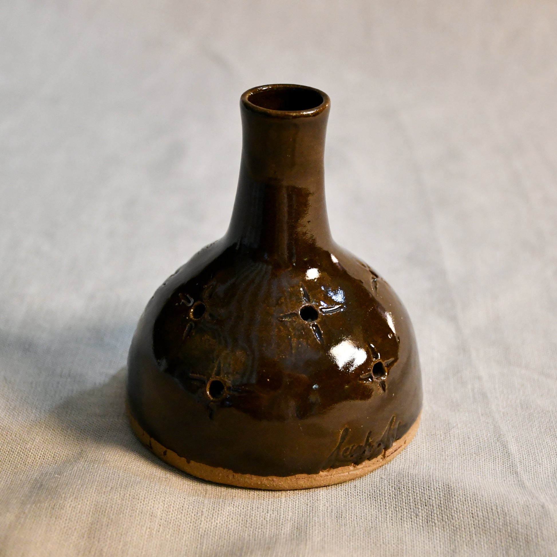 Handmade countertop chiminea, wheel thrown, hand-carved, fit for a tea light and glazed in Coffee Bean glaze. 