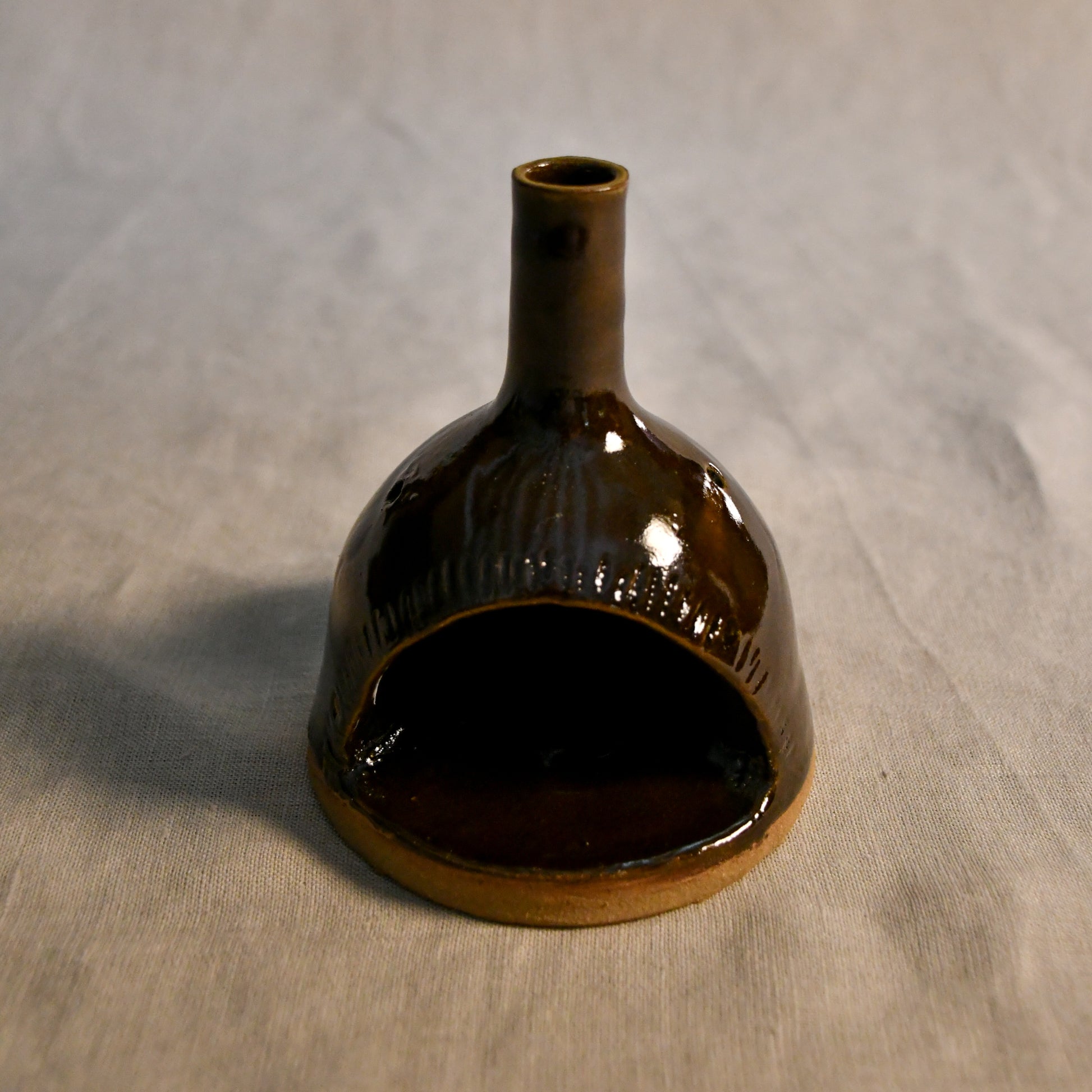 Handmade countertop chiminea, wheel thrown, hand-carved, fit for a tea light and glazed in Coffee Bean glaze. 