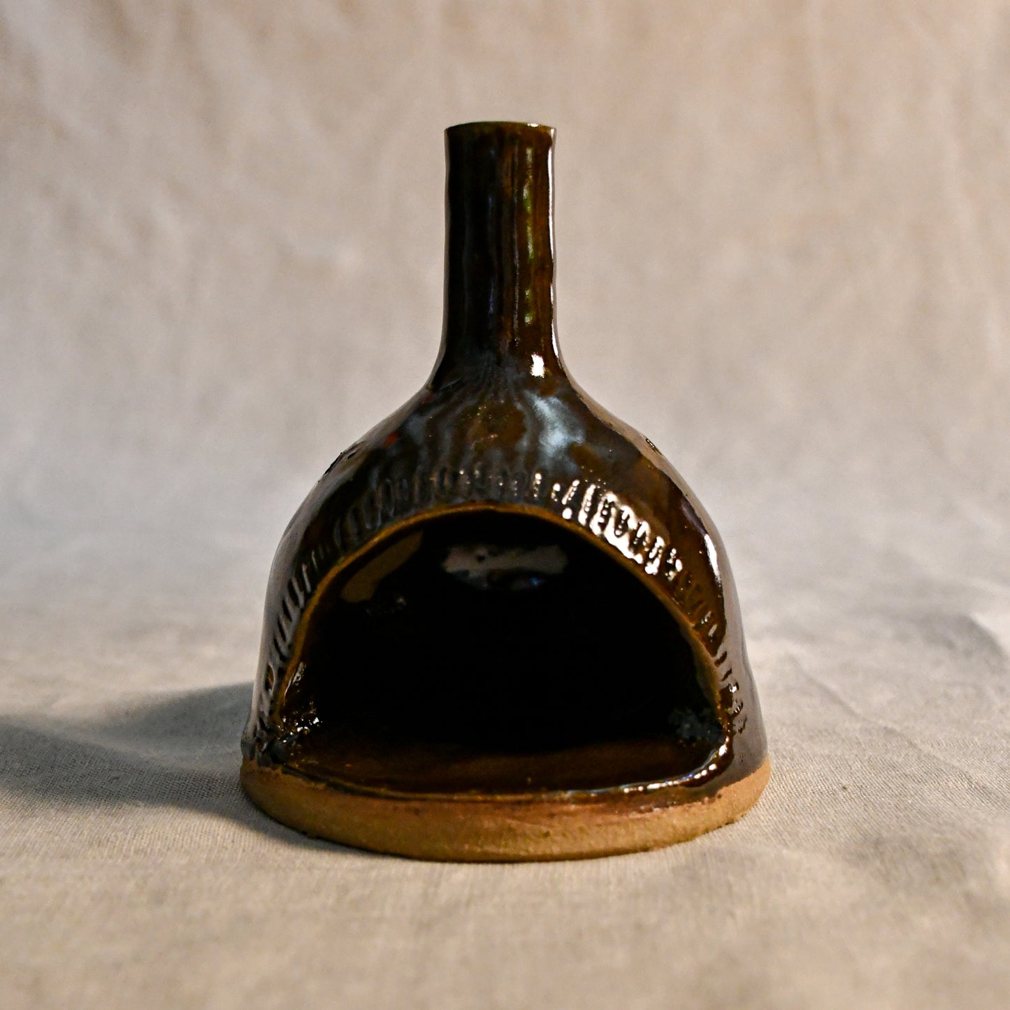 Handmade countertop chiminea, wheel thrown, hand-carved, fit for a tea light and glazed in Coffee Bean glaze. 