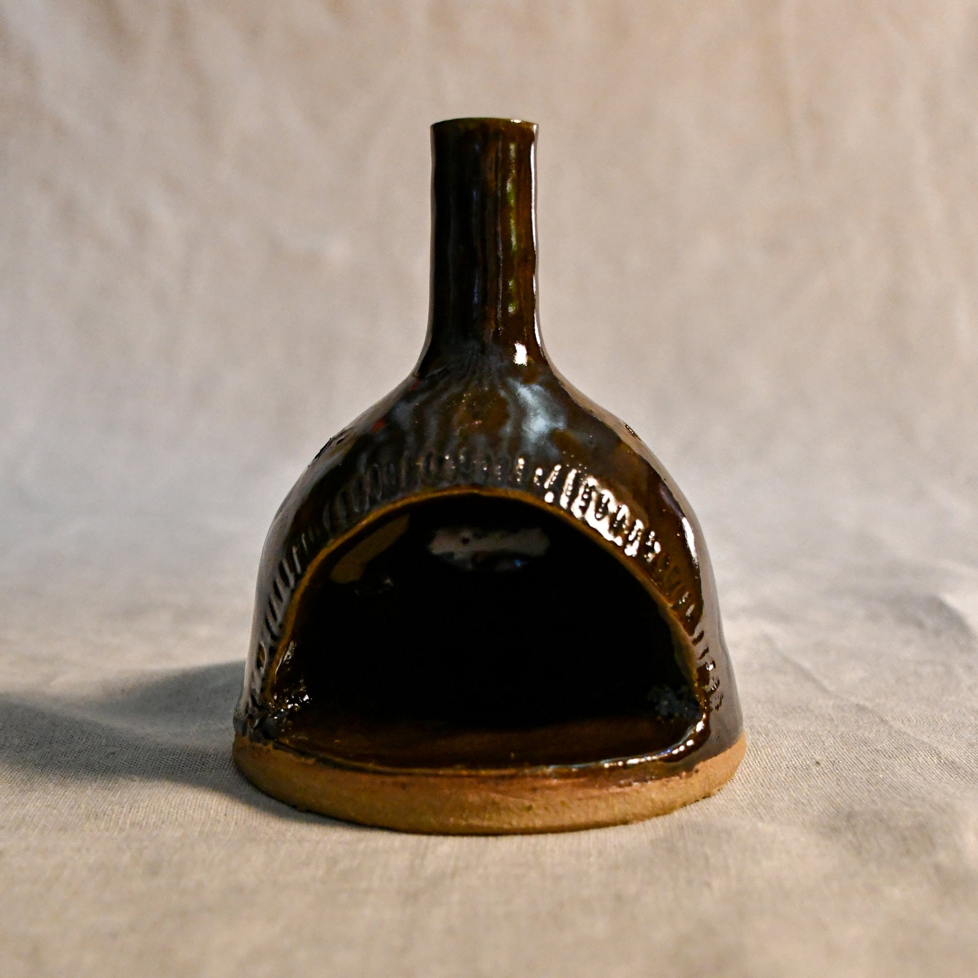 Handmade countertop chiminea, wheel thrown, hand-carved, fit for a tea light and glazed in Coffee Bean glaze. 