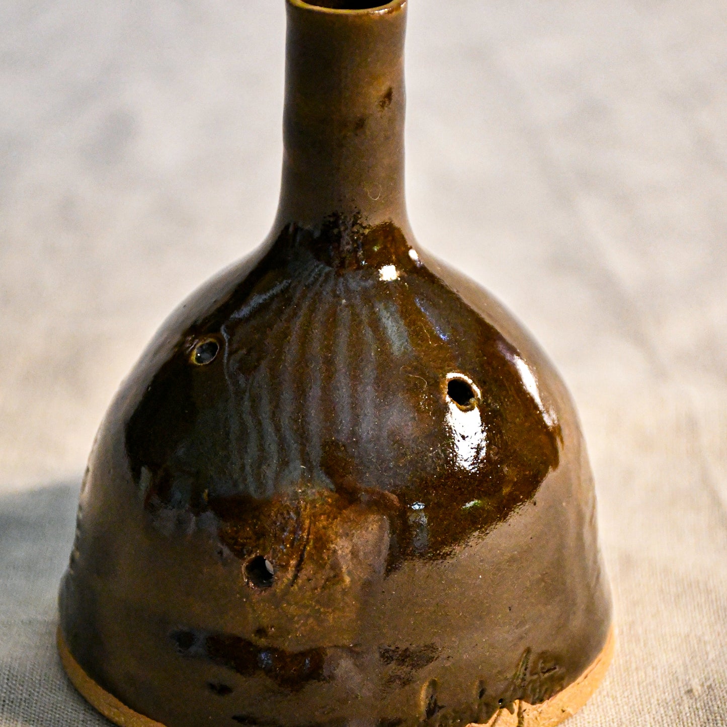 Handmade countertop chiminea, wheel thrown, hand-carved, fit for a tea light and glazed in Coffee Bean glaze. 