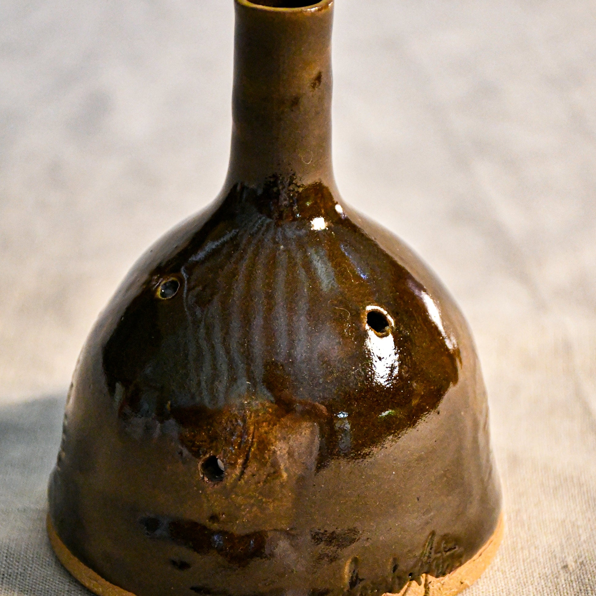 Handmade countertop chiminea, wheel thrown, hand-carved, fit for a tea light and glazed in Coffee Bean glaze. 