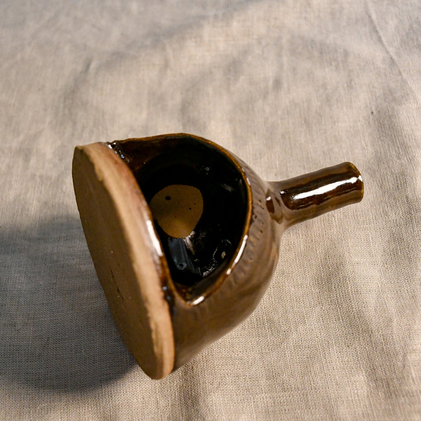 Handmade countertop chiminea, wheel thrown, hand-carved, fit for a tea light and glazed in Coffee Bean glaze. 
