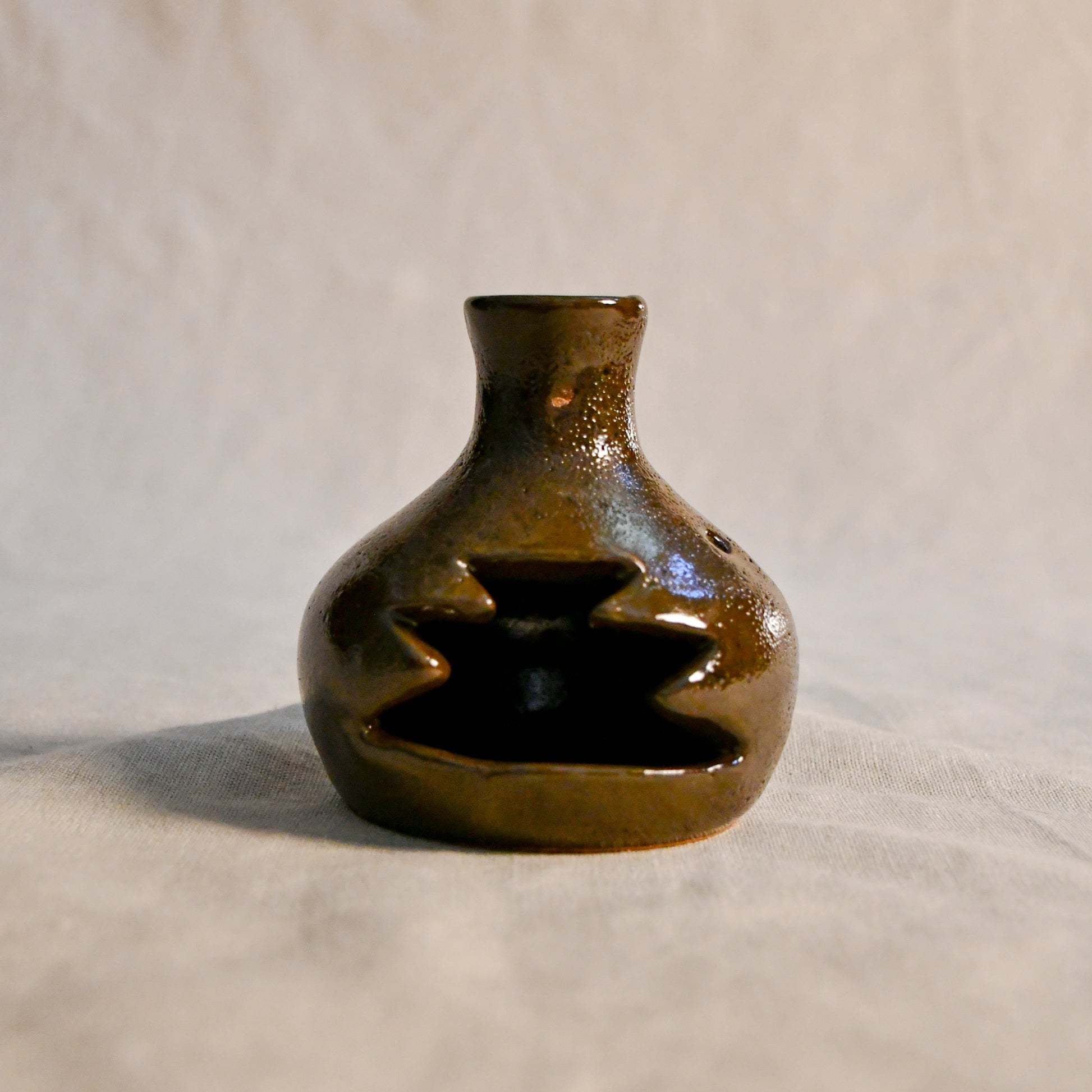 Handmade countertop chiminea, wheel thrown, hand-carved, glazed in Coffee Bean glaze. 