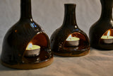 Lit handmade countertop chimineas, wheel thrown, hand-carved, fit for a tea lights and glazed in Coffee Bean glaze. 
