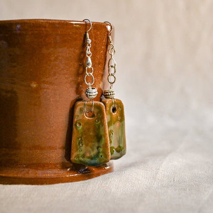 Handmade ceramic dangle earrings by Leigh Art with a modern boho silhouette.