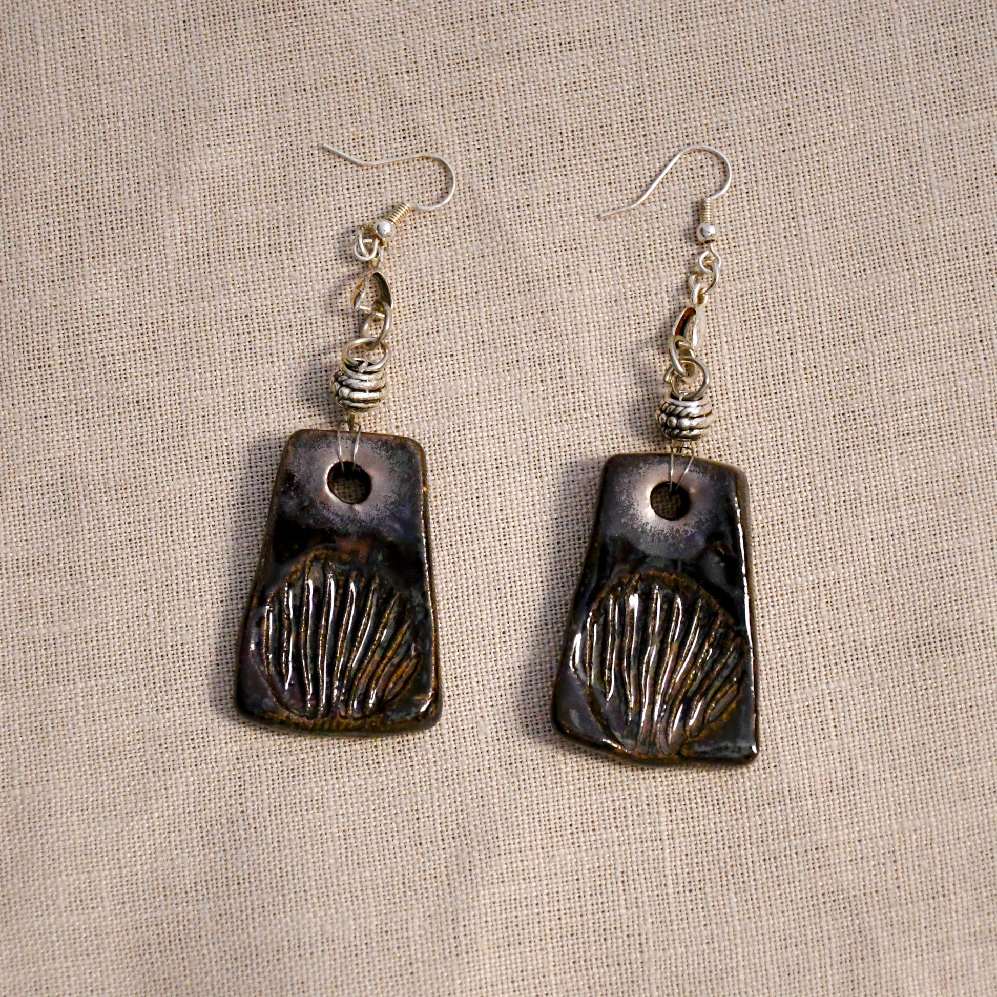 Handmade ceramic stamped dangle earrings by Leigh Art.