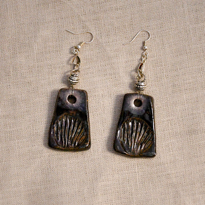 Handmade ceramic stamped dangle earrings by Leigh Art.
