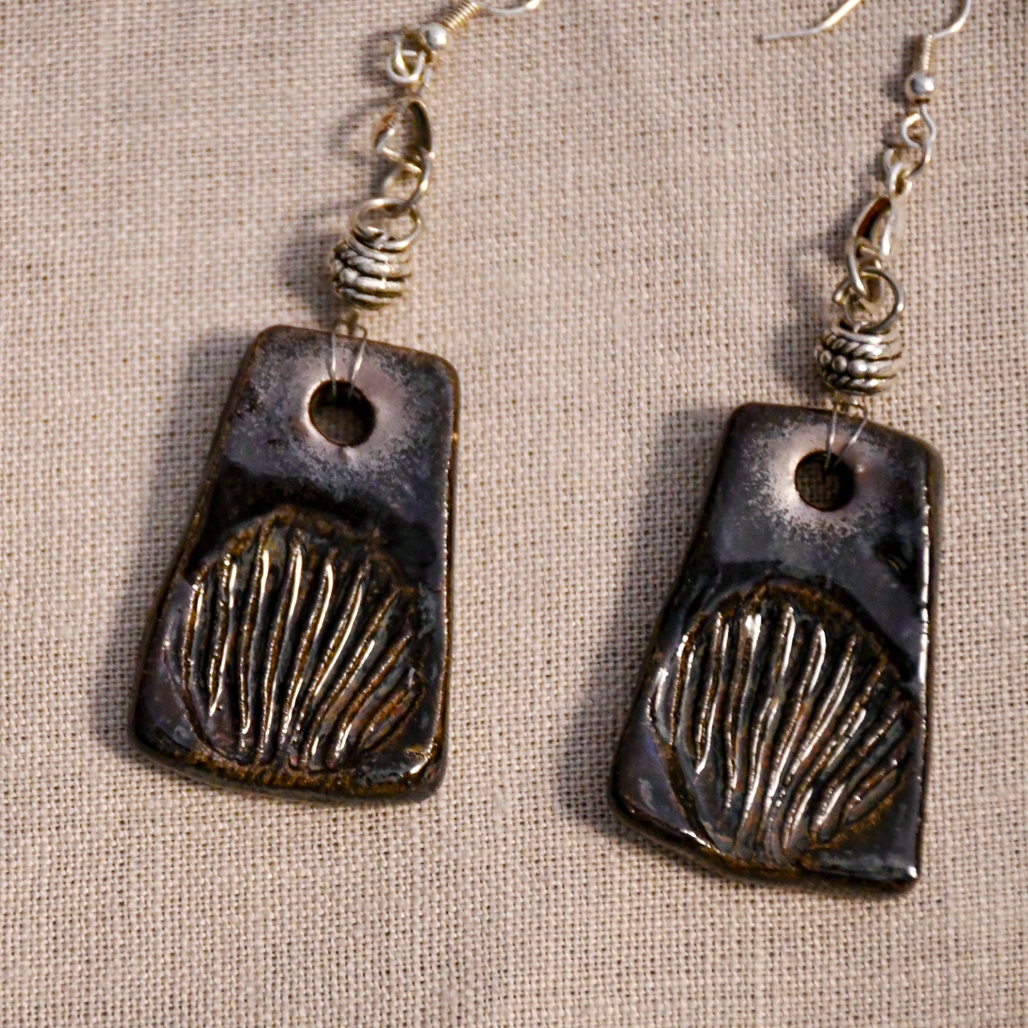 Handmade ceramic stamped dangle earrings by Leigh Art.