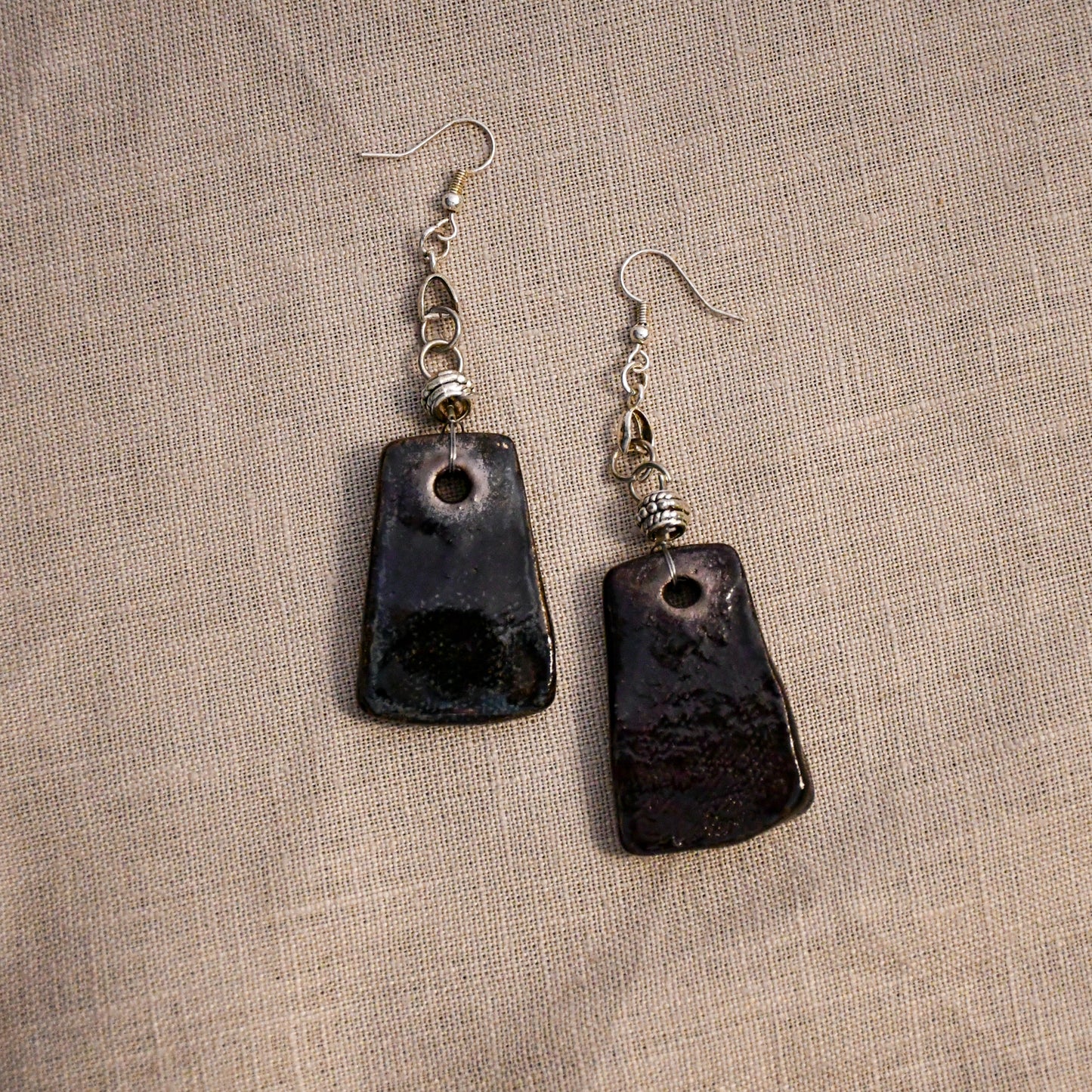 Handmade ceramic stamped dangle earrings by Leigh Art.