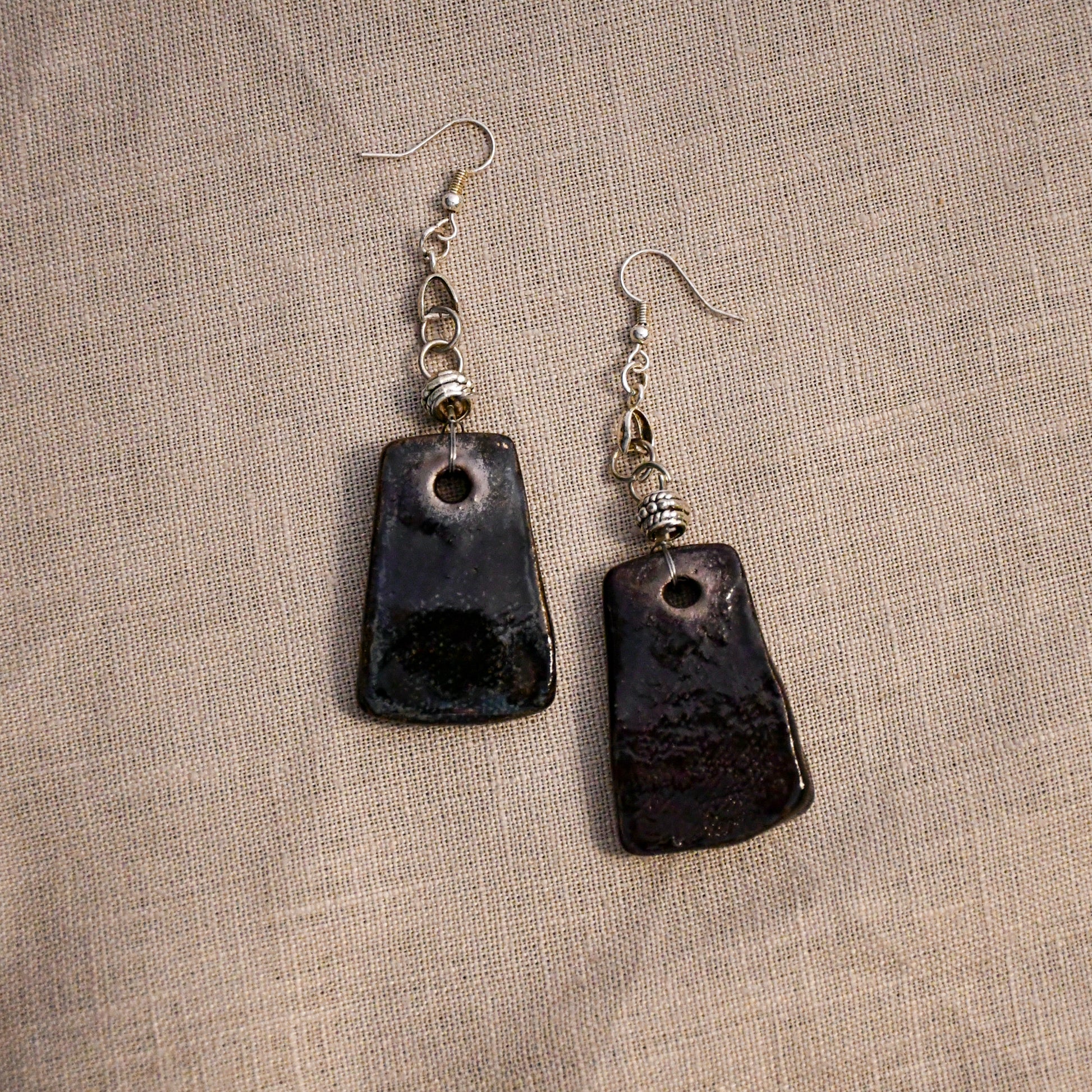 Handmade ceramic stamped dangle earrings by Leigh Art.