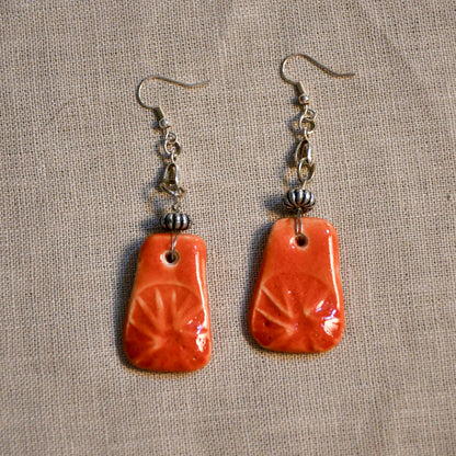 Handmade ceramic stamped dangle earrings by Leigh Art.