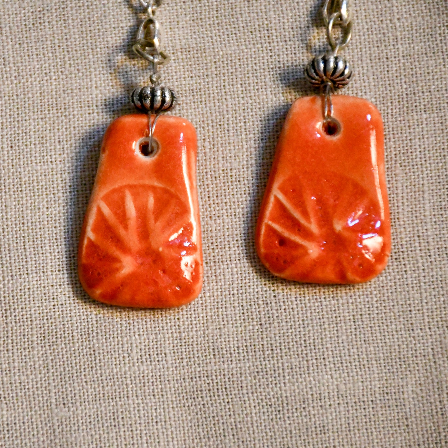 Handmade ceramic stamped dangle earrings by Leigh Art.