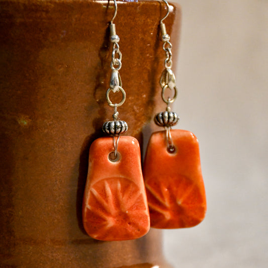 Handmade ceramic stamped dangle earrings by Leigh Art.