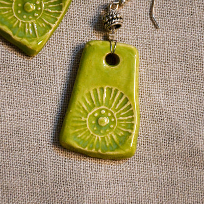 Handmade ceramic stamped dangle earrings by Leigh Art.