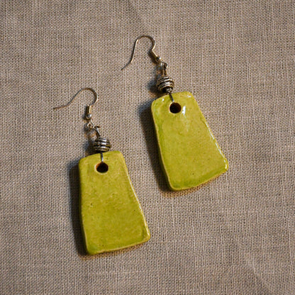 Handmade ceramic stamped dangle earrings by Leigh Art.