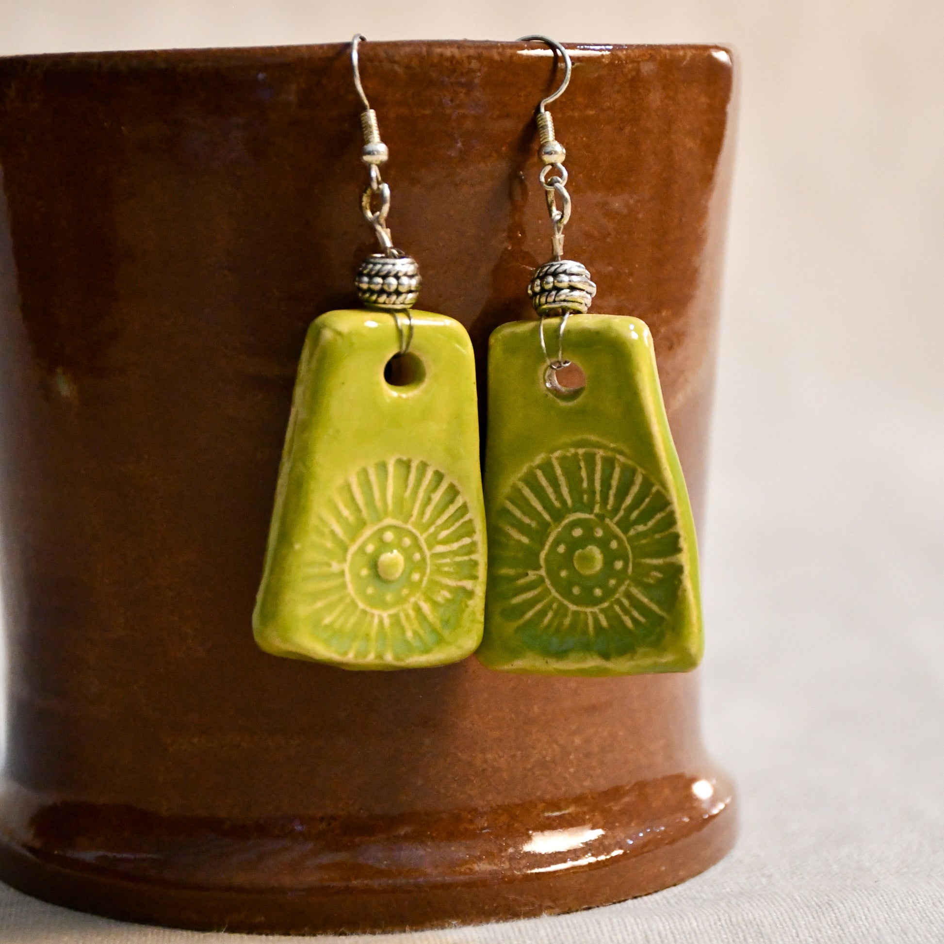 Handmade ceramic stamped dangle earrings by Leigh Art.