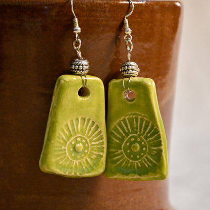 Handmade ceramic stamped dangle earrings by Leigh Art.