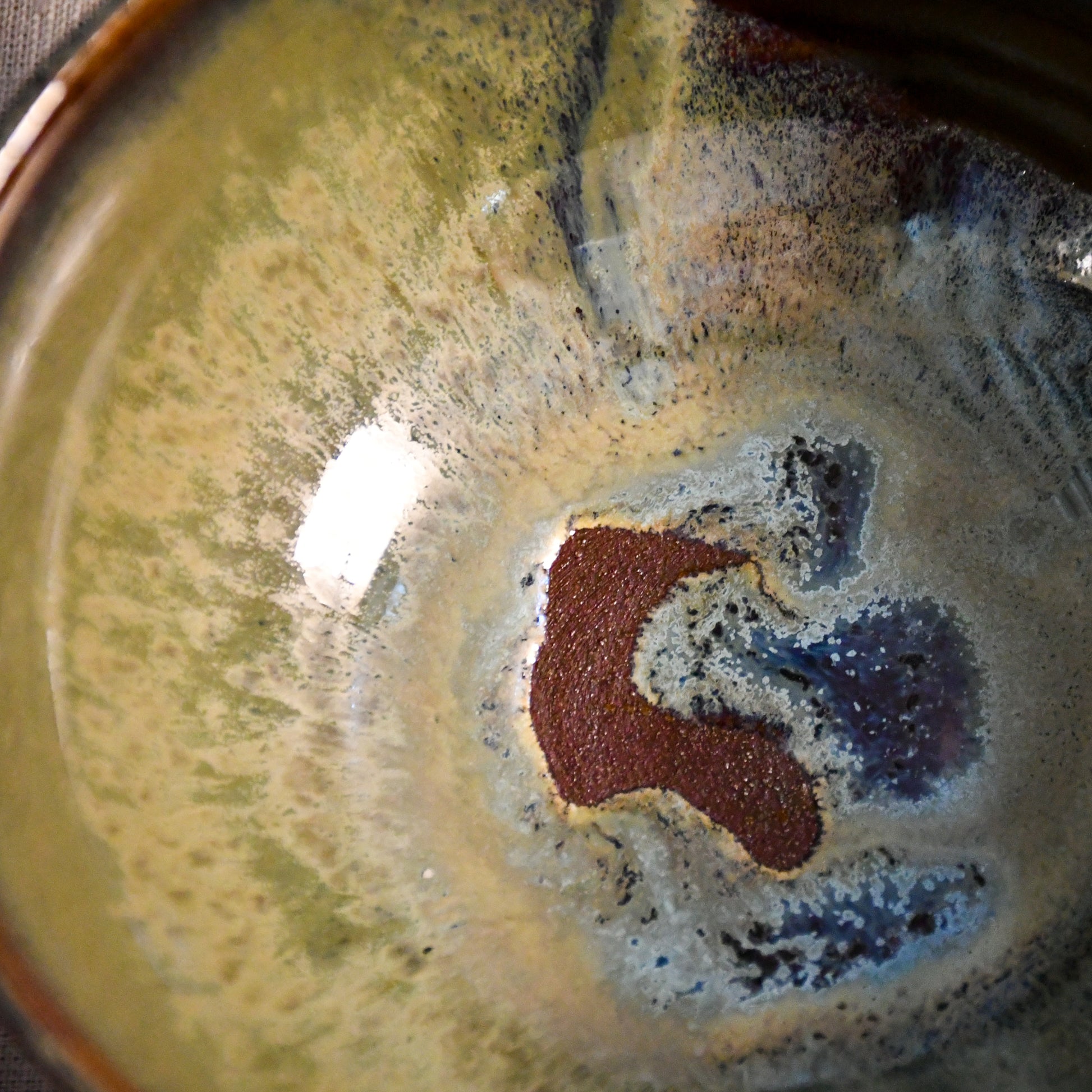 Handmade ceramic chili bowl by Leigh Art featuring Espuela glaze with one-of-a-kind earth-tone movement and wheel-thrown craftsmanship.