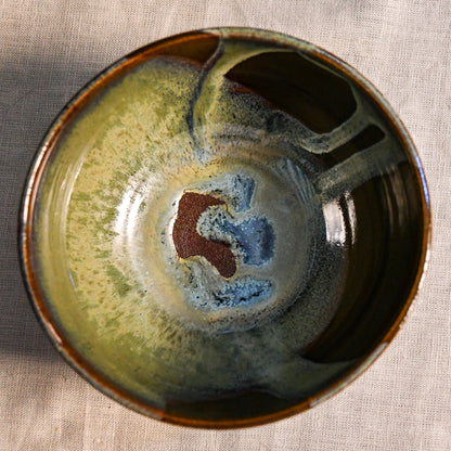 Handmade ceramic chili bowl by Leigh Art featuring Espuela glaze with one-of-a-kind earth-tone movement and wheel-thrown craftsmanship.