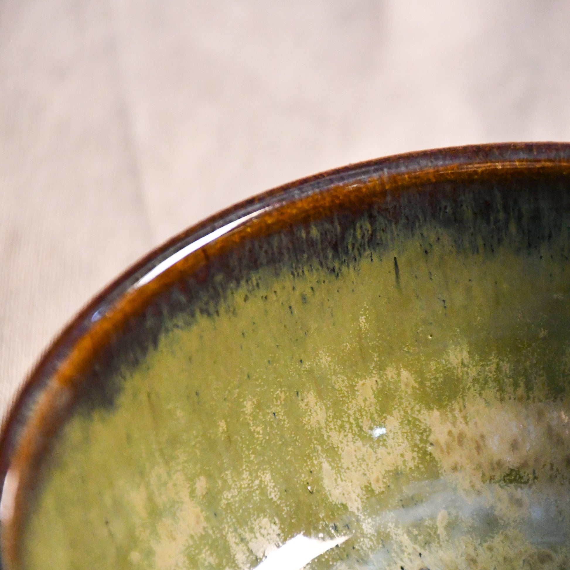 Handmade ceramic chili bowl by Leigh Art featuring Espuela glaze with one-of-a-kind earth-tone movement and wheel-thrown craftsmanship.