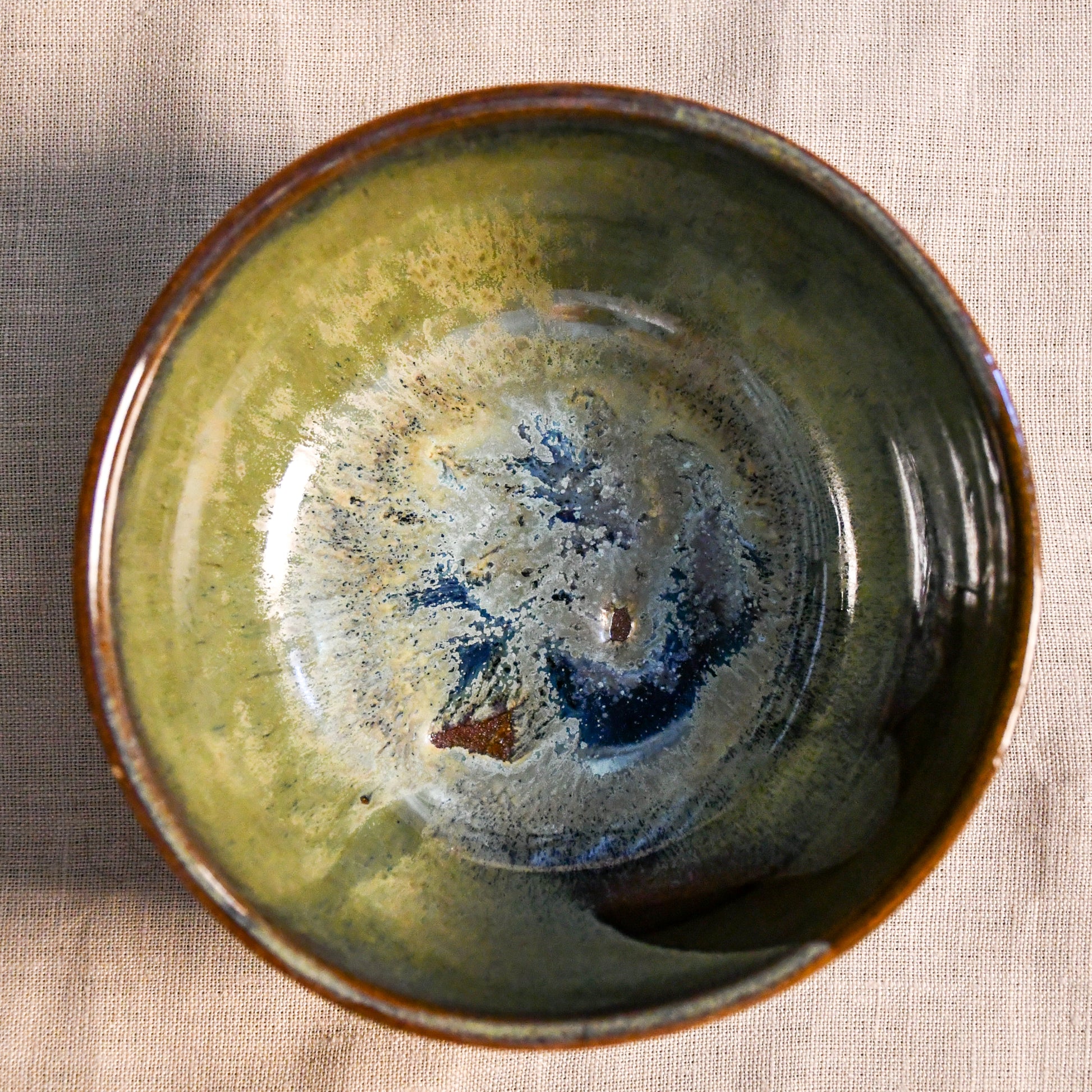 Handmade ceramic chili bowl by Leigh Art featuring Espuela glaze with one-of-a-kind earth-tone movement and wheel-thrown craftsmanship.