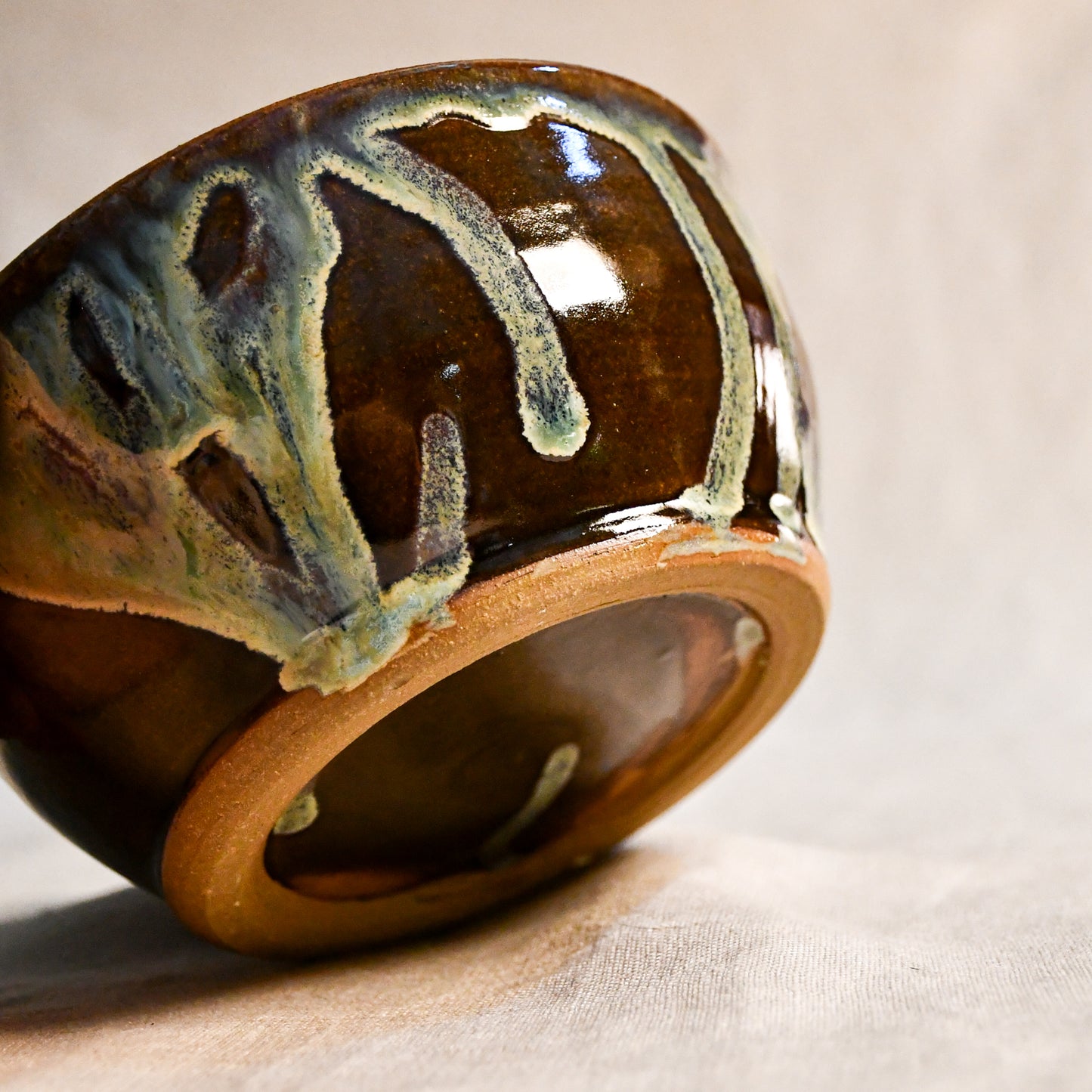 Handmade ceramic chili bowl by Leigh Art featuring Espuela glaze with one-of-a-kind earth-tone movement and wheel-thrown craftsmanship.