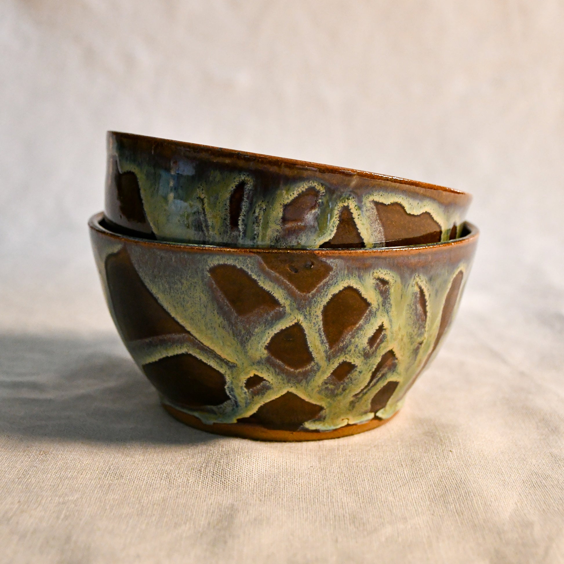 Handmade ceramic chili bowl by Leigh Art featuring Espuela glaze with one-of-a-kind earth-tone movement and wheel-thrown craftsmanship.