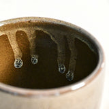 Handmade ceramic mug by Leigh Art featuring Espuela glaze with one-of-a-kind earth-tone movement and wheel-thrown craftsmanship.