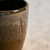 Handmade ceramic mug by Leigh Art featuring Espuela glaze with one-of-a-kind earth-tone movement and wheel-thrown craftsmanship.