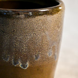 Handmade ceramic mug by Leigh Art featuring Espuela glaze with one-of-a-kind earth-tone movement and wheel-thrown craftsmanship.