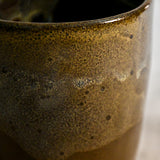 Handmade ceramic mug by Leigh Art featuring Espuela glaze with one-of-a-kind earth-tone movement and wheel-thrown craftsmanship.