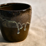 Handmade ceramic mug by Leigh Art featuring Espuela glaze with one-of-a-kind earth-tone movement and wheel-thrown craftsmanship.