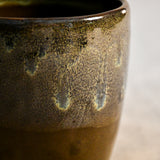 Handmade ceramic mug by Leigh Art featuring Espuela glaze with one-of-a-kind earth-tone movement and wheel-thrown craftsmanship.