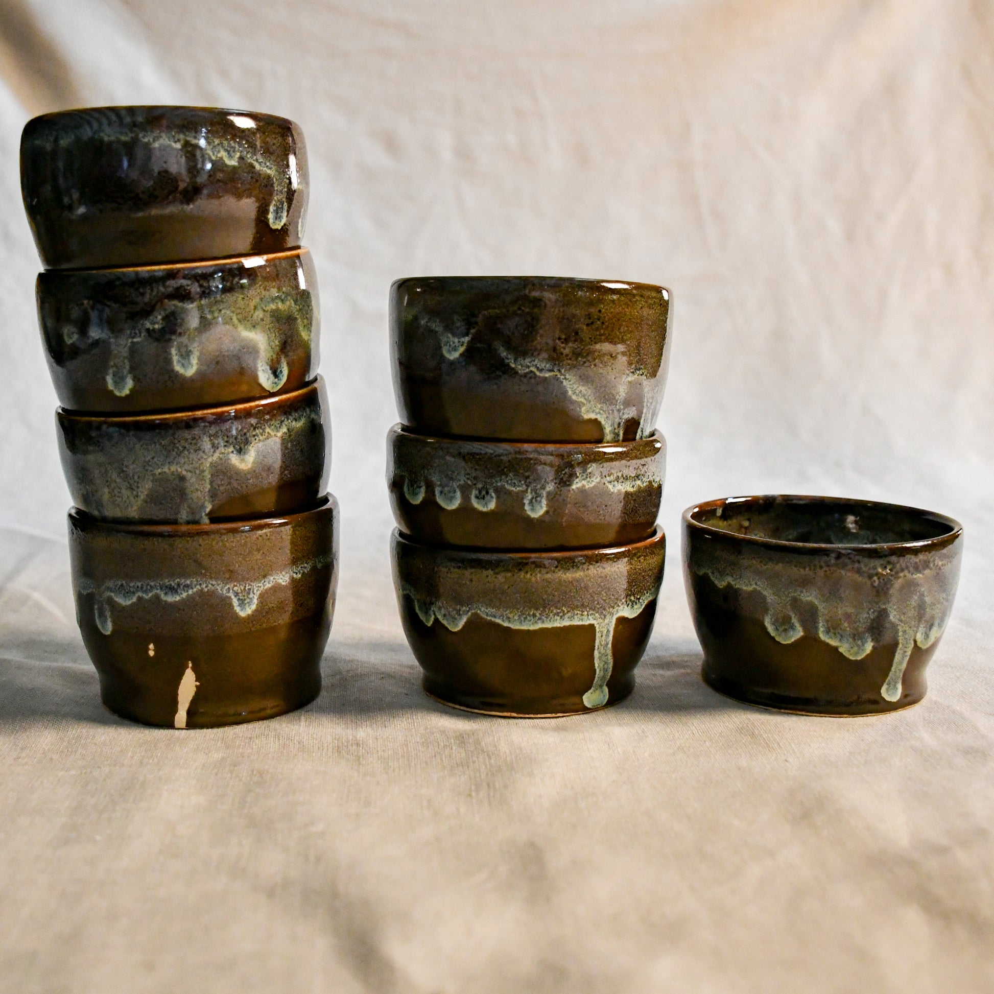 Handmade ceramic salsa bowl by Leigh Art featuring Espuela glaze with one-of-a-kind earth-tone movement and wheel-thrown craftsmanship.