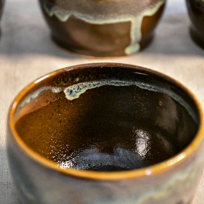 Handmade ceramic salsa bowl by Leigh Art featuring Espuela glaze with one-of-a-kind earth-tone movement and wheel-thrown craftsmanship.