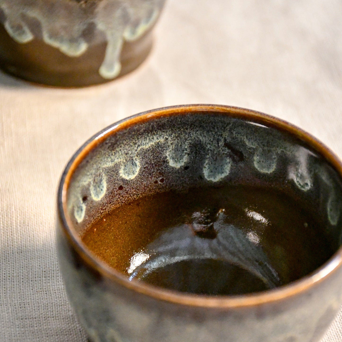 Handmade ceramic salsa bowl by Leigh Art featuring Espuela glaze with one-of-a-kind earth-tone movement and wheel-thrown craftsmanship.