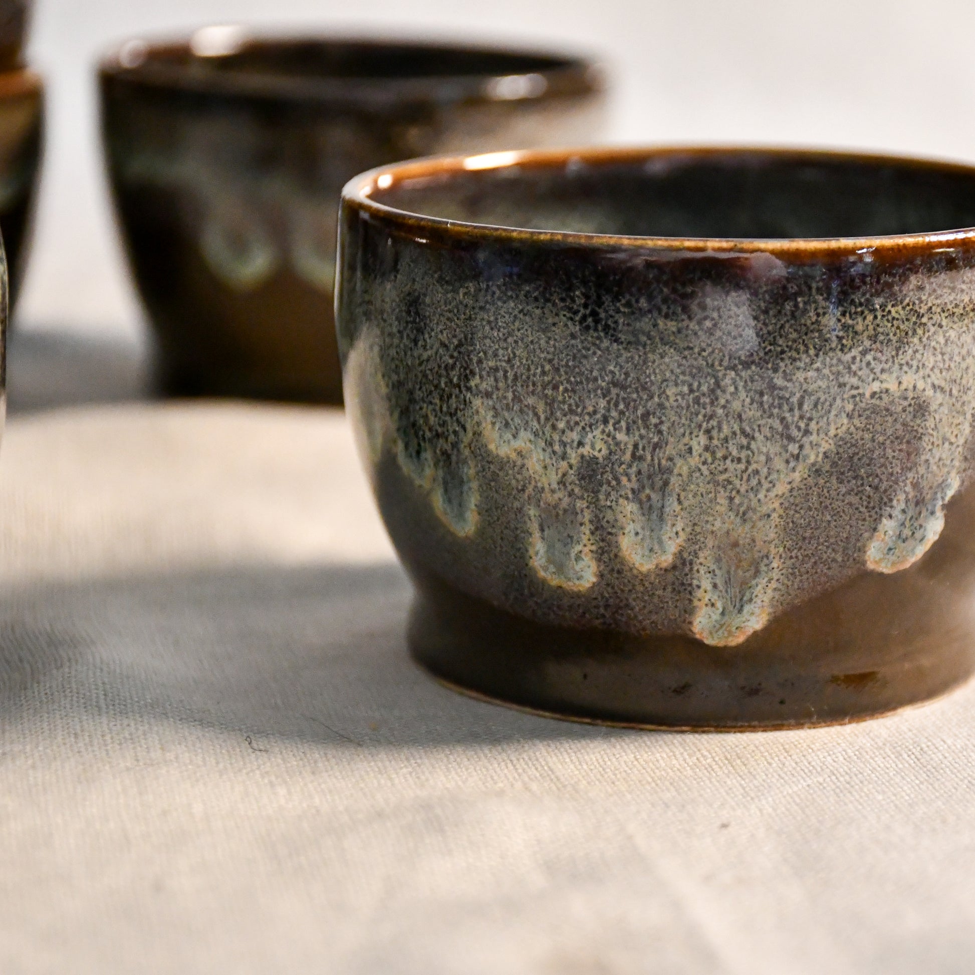 Handmade ceramic salsa bowl by Leigh Art featuring Espuela glaze with one-of-a-kind earth-tone movement and wheel-thrown craftsmanship.