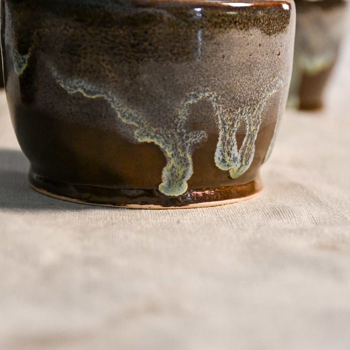 Handmade ceramic salsa bowl by Leigh Art featuring Espuela glaze with one-of-a-kind earth-tone movement and wheel-thrown craftsmanship.