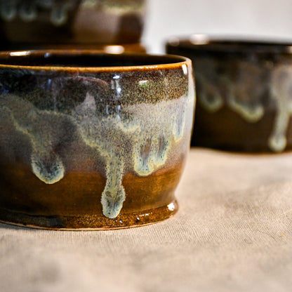 Handmade ceramic salsa bowl by Leigh Art featuring Espuela glaze with one-of-a-kind earth-tone movement and wheel-thrown craftsmanship.
