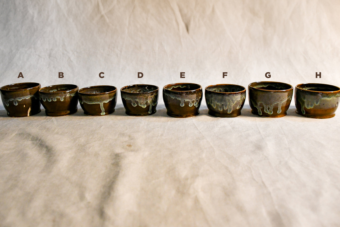 Handmade ceramic salsa bowl by Leigh Art featuring Espuela glaze with one-of-a-kind earth-tone movement and wheel-thrown craftsmanship.
