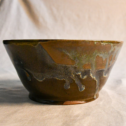 Handmade ceramic serving bowl by Leigh Art featuring Espuela glaze with one-of-a-kind earth-tone movement and wheel-thrown craftsmanship.