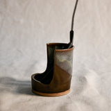 Handmade Espuela ceramic spoon rest by Leigh Art featuring layered earth-tone glaze with organic movement and one-of-a-kind variation.