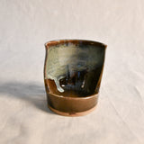 Handmade Espuela ceramic spoon rest by Leigh Art featuring layered earth-tone glaze with organic movement and one-of-a-kind variation.