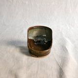Handmade Espuela ceramic spoon rest by Leigh Art featuring layered earth-tone glaze with organic movement and one-of-a-kind variation.