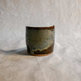Handmade Espuela ceramic spoon rest by Leigh Art featuring layered earth-tone glaze with organic movement and one-of-a-kind variation.