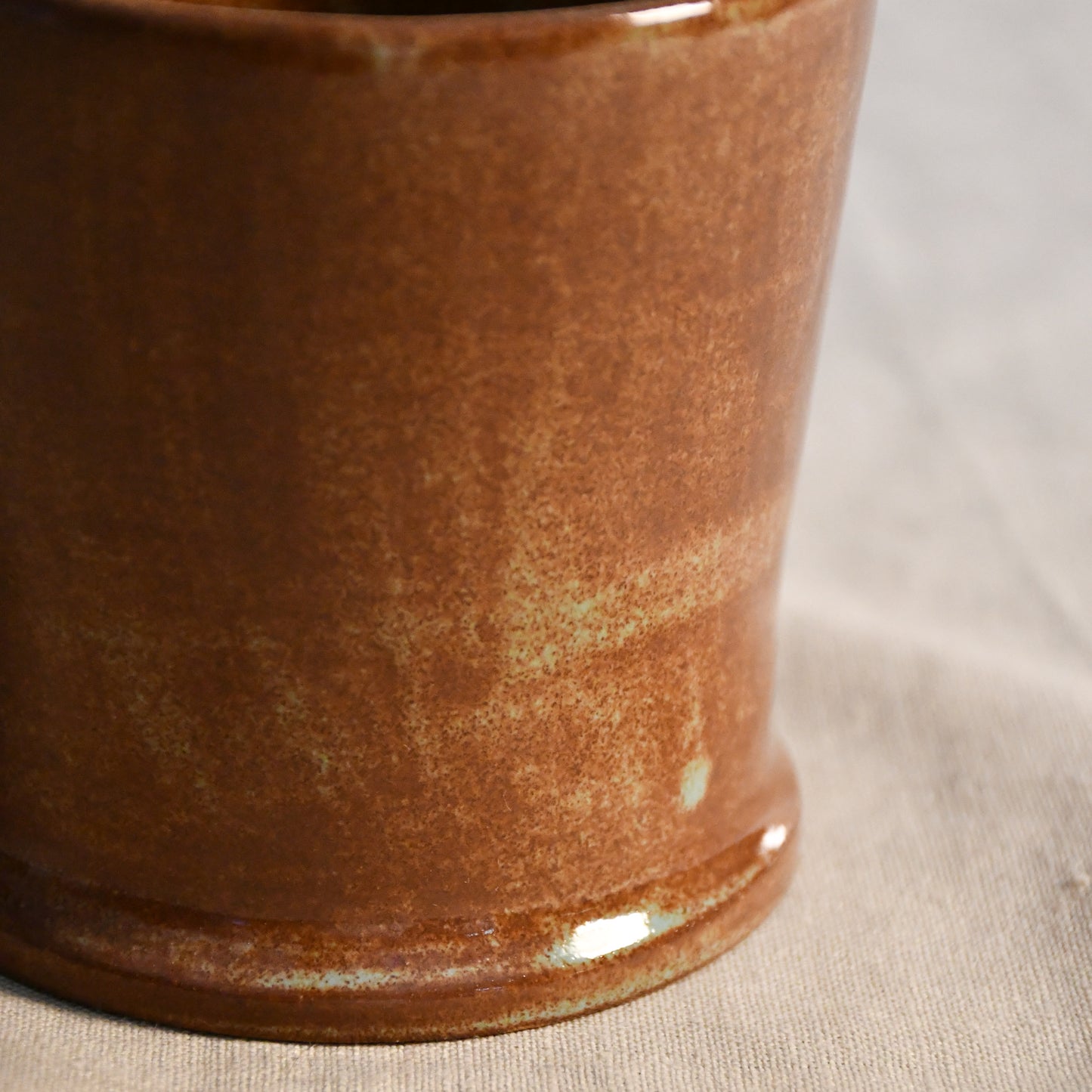Handmade Heirloom Blue ceramic vessel by Leigh Art featuring chestnut brown and blue-green glaze variation, wheel-thrown stoneware accent piece from the Clayground collection.