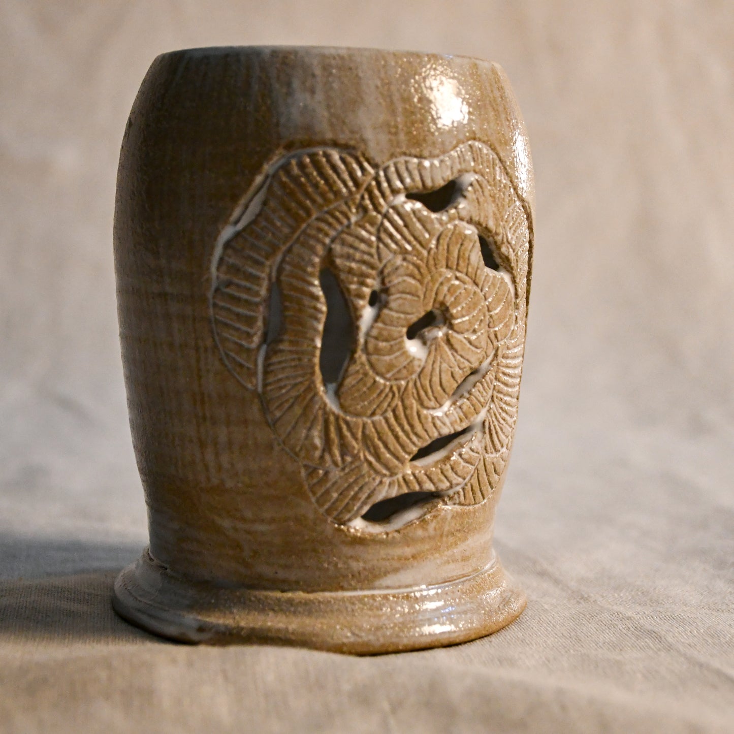 White handmade wheel thrown, hand carved Peony design lantern fit for a tea light. 