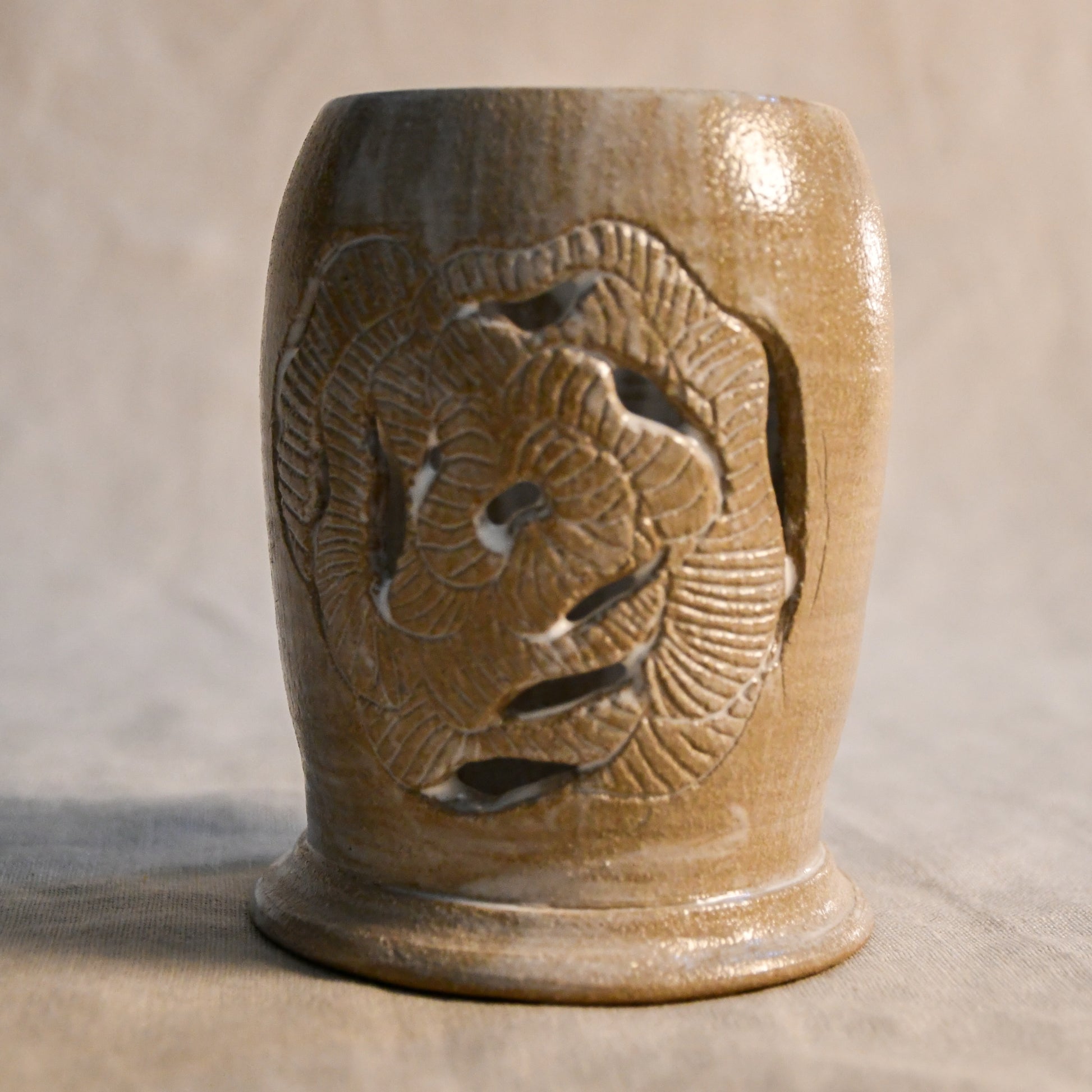 White handmade wheel thrown, hand carved Peony design lantern fit for a tea light. 