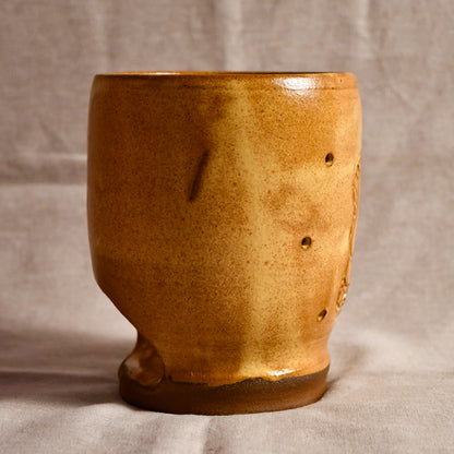 Yellow side view of a ceramic lantern